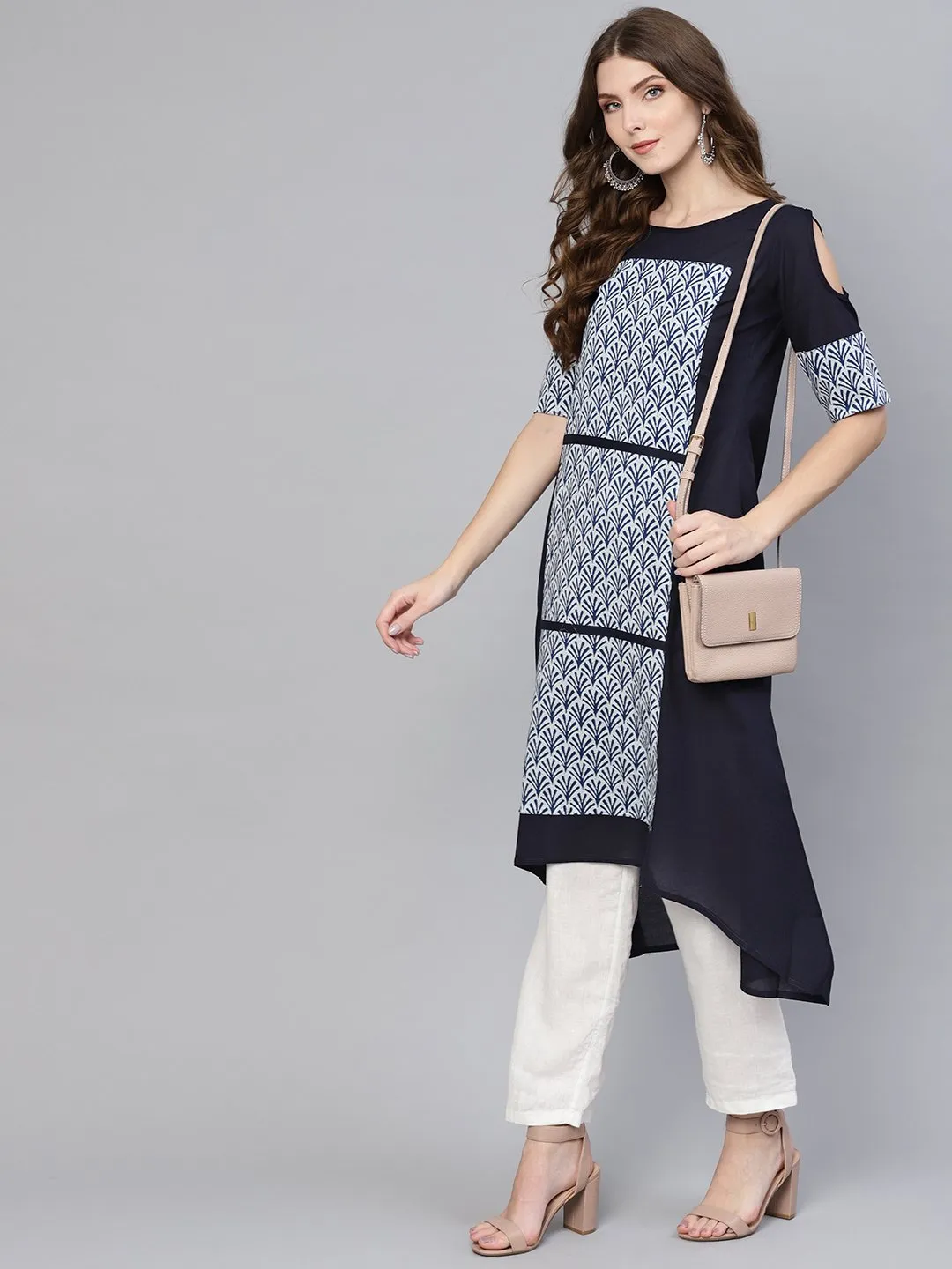 Solid Navy Blue Asymetric A-Line Kurti With Navy Blue Floral Printed Patches On The Yoke With A Boat Neck And Elbow Sleeves