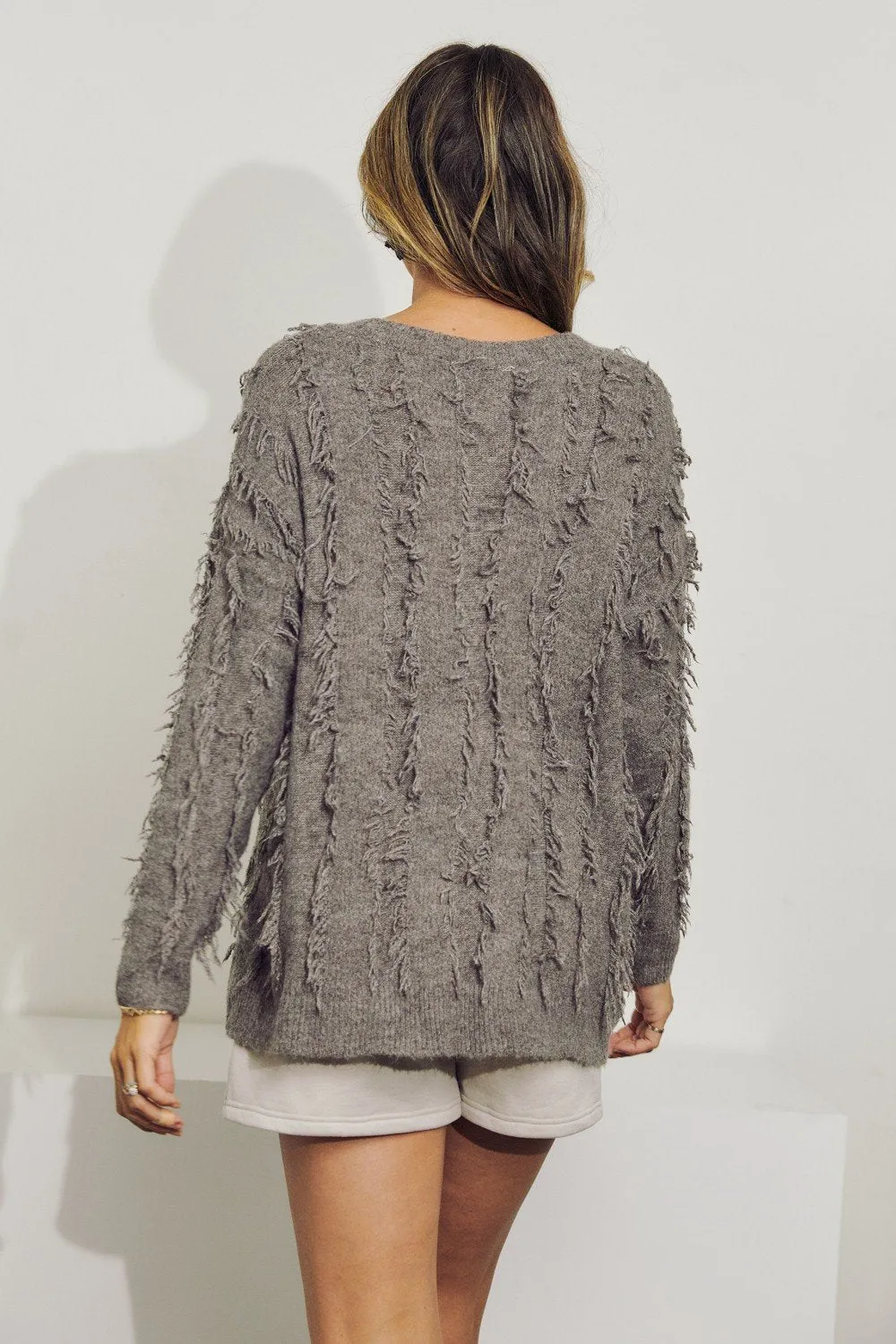 V-Neck long sleeve wool sweater top with fringe